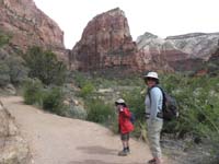 02-Kenny_and_Mommy_on_the_trail_with_Angels_Landing_in_distance-started_off_a_little_cool-even_in_late_morning
