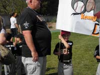 11-Kenny_holding_team_banner-Coach_Tom