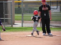 27-Kenny_runs_to_first_base