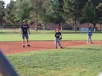 38-Kenny_playing_shortstop-Daddy_coaching