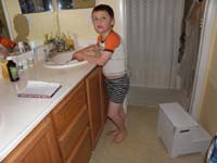 15-look_Kenny_is_tall_enough_that_he_doesn't_need_the_step_to_brush_his_teeth