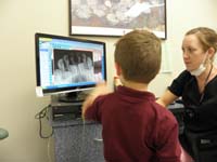 18-looking_at_Kenny's_xrays-see_the_adult_teeth_are_almost_ready_to_come_out
