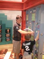22-Daddy_and_Kenny_work_together_to_fix_something