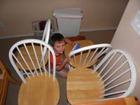 15-Kenny_makes_a_fort_with_chairs_while_Daddy_cleans_kitchen_floor