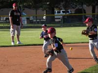 09-another_play_at_shortstop-Luke_rushing_to_cover_third_base