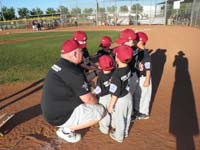 28-team_huddles_together_for_end_of_game_cheer