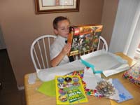 29-opening_his_present_from_Mommy-Hobbit_Lego