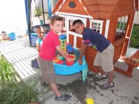 12-playing_with_water_in_our_backyard_with_Aiden_and_Cash