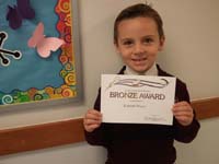 08-Kenny_shows_off_his_award