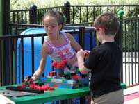 46-Sierra_and_Kenny_biding_time_playing_with_legos_while_adults_in_line