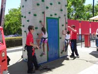 59-climbing_wall_fun_for_Sierra-Kenny_wouldn't_do_it_so_he_watched_Sierra