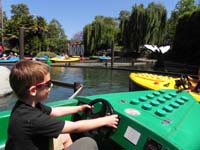 74-Skipper_School_fun-Kenny_driving_the_boat-rather_running_into_another_boat