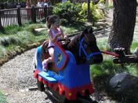 80-Royal_Joust_fun-Sierra_again_waving_to_the_crowd_like_a_princess