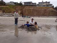 14-Daddy,Kenny,Sierra_digging_a_hole_in_the_sand_building_a_fort-Baba_watches