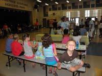 01-first_day_for_two_week_writing_camp_at_local_elementary_school-kids_waiting_to_be_taken_to_classroom