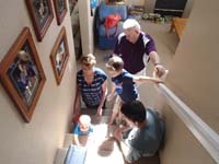 01-coaxing_Wade_to_climb_the_stairs_using_a_tablet_as_bait