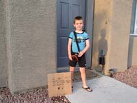 01-Kenny_and_his_sign_to_warn_away_burglars-very_cute
