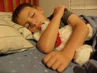 40-sleeping_little_boy-hard_day_at_sports_camp-bruise_above_eye_from_being_hit_by_a_ball