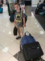 50-Kenny_pulling_his_weight_through_the_Atlanta_airport
