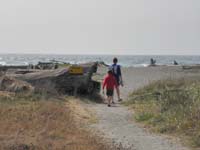 03-visiting_the_beach_behind_visitor_center-note_sign_warning_about_sneaker_waves