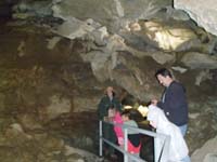 06-admiring_a_large_room_in_the_cave