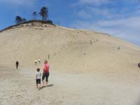 41-Kenny_and_Mommy_heading_to_sand_dunes-steep,hot_sand,cool_after_feet_sink_into_sand