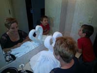 72-Mommy_and_Kenny_pose_with_ornate_swan_towel_decoration