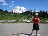 12-Kenny_at_Paradise_with_Mount_Rainier-walkie_talkie_to_communicate_with_Daddy_out_there_on_trail