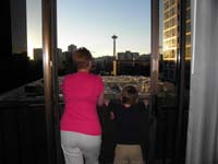 21-Mommy_and_Kenny_enjoy_the_sunset_from_the_balcany_watching_the_Seattle_Space_Needle