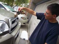 07-Daddy_gets_to_remove_a_bird_from_the_grill_of_the_4Runner_that_Mommy_hit
