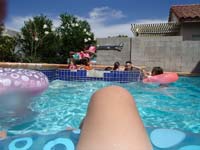09-Kenny's_picture-floating_on_a_tube_in_Zoe's_pool
