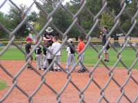 16-first_practice_for_Coach_Pitch_little_league_baseball-Daddy_greeting_team