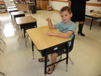 08-Kenny_sitting_at_his_desk