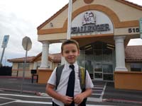 15-Kenny_at_the_entrance_to_the_school