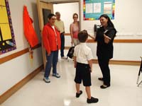 20-family_is_greeted_by_his_teacher_Diana_Shamirza