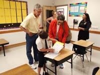 21-Kenny_shows_Baba_and_Poppy_the_stuff_in_his_desk