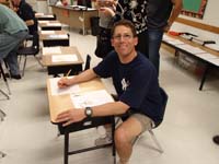 17-parent_orientation_meeting_at_school-Daddy_gets_to_sit_in_Kenny's_desk