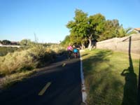 12-riding_his_bike_with_Darby-Kenny_likes_going_for_the_bike_ride_while_Mommy_and_friends_run