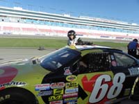 30-Daddy_having_some_trouble_getting_out_of_the_race_car-don't_used_to_it_and_wearing_the_equipment