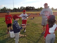 26-showing_how_to_hold_the_bat_to_bunt_and_balance_with_one_hand