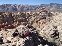 40-Kenny's_picture-our_sitting_place_and_Calico_Hills_in_background
