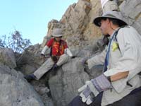 49-we_dropped_down_right_below_peak-Daddy_helping_Kenny_climb_down_rocks