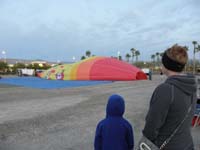 02-Kenny_and_Mommy_admiring_the_balloons_as_they_are_blown_up-before_sunrise