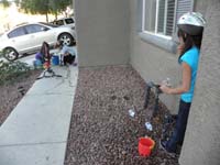 01-Kenny,Tara,and_Sarena_playing_in_front_yard