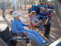 18-Poppy_watching_the_game,Mommy_has_her_nose_in_her_phone_and_watches_the_game