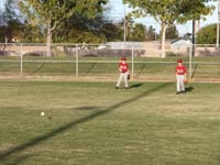 19-Kenny_and_Jeremy_fields_ball_hit_deep_into_outfield