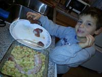08-Kenny_helping_Mommy_prepare_the_turkey_while_Daddy_works_at_Red_Rock-holding_turkey_liver