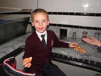 04-Kenny_lost_his_first_tooth_eating_pizza_at_'Secret_Pizza'_at_Cosmopolitan