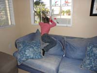 33-Kenny_impatiently_waiting_for_friends_to_arrive_for_party-'Don't_take_pictures,not_fun,seriously'