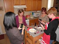 34-sign_of_the_times,women_with_noses_in_smartphones-entering_beer_into_an_app
